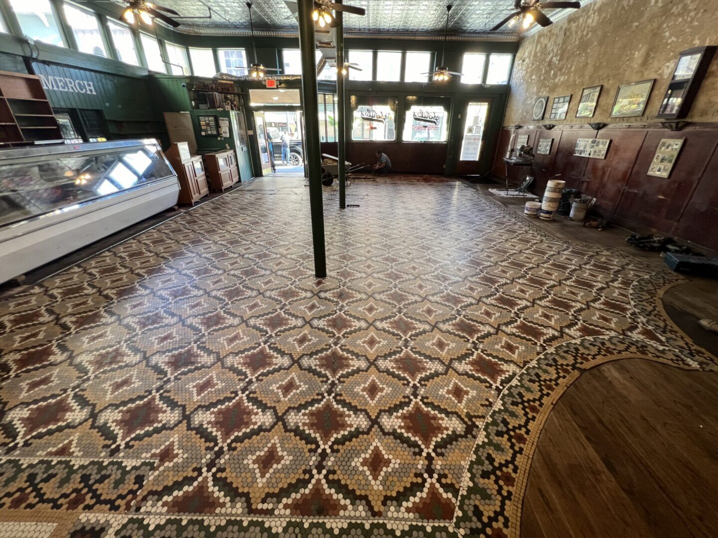 Intricate patterned flooring enhances the ambiance of a construction space, showcasing the beauty of Metallic Epoxy Flooring.