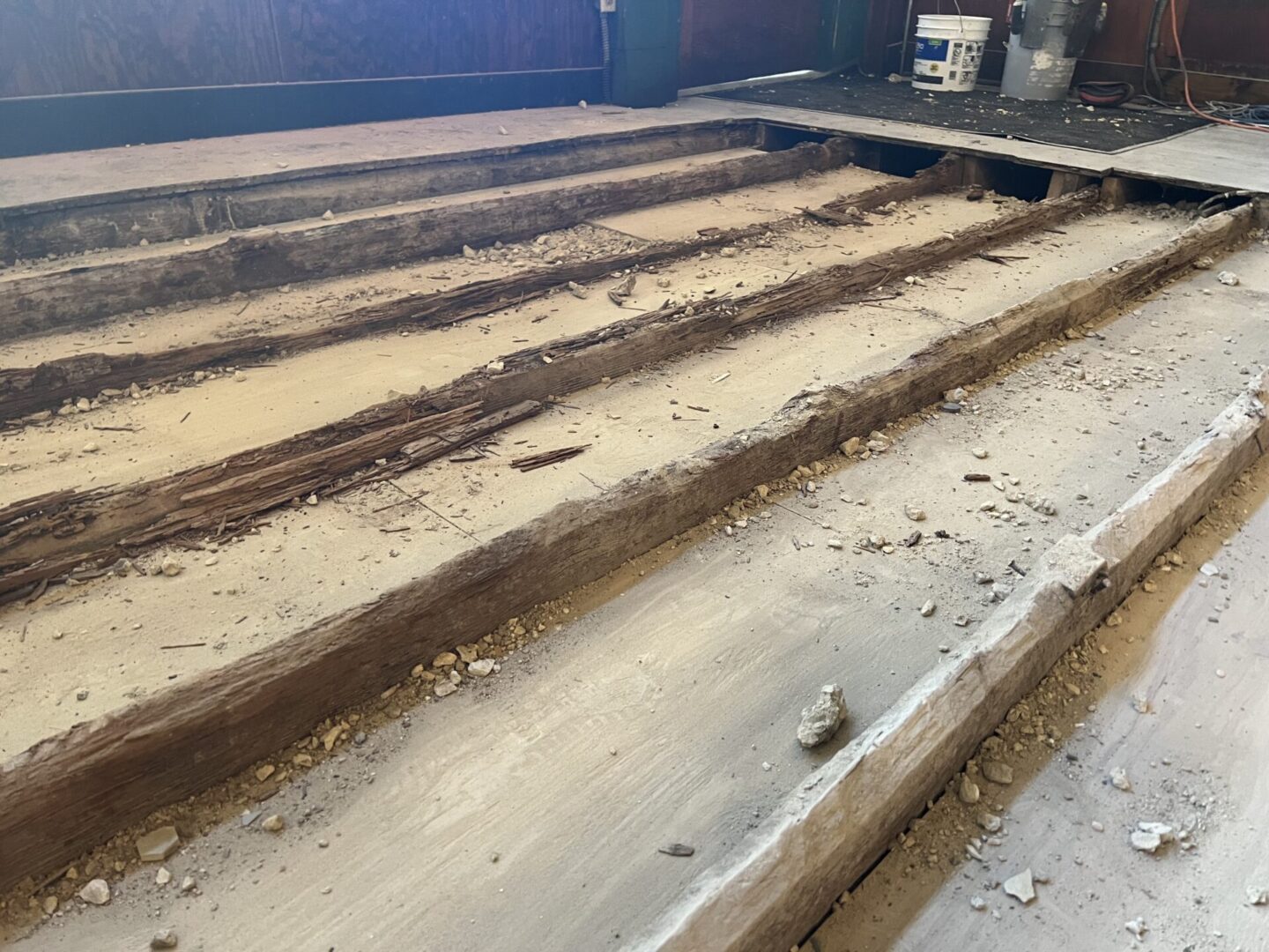 Exposed wooden floor joists during renovation
