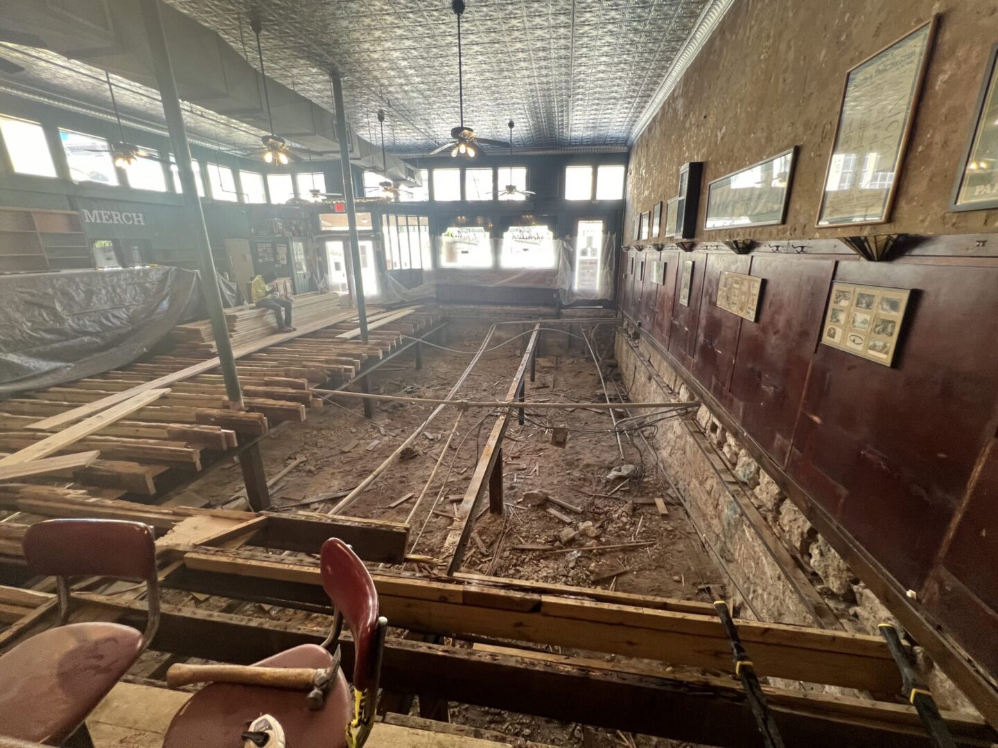 Construction site showing exposed flooring and beams, preparing for installation of Metallic Epoxy Flooring.