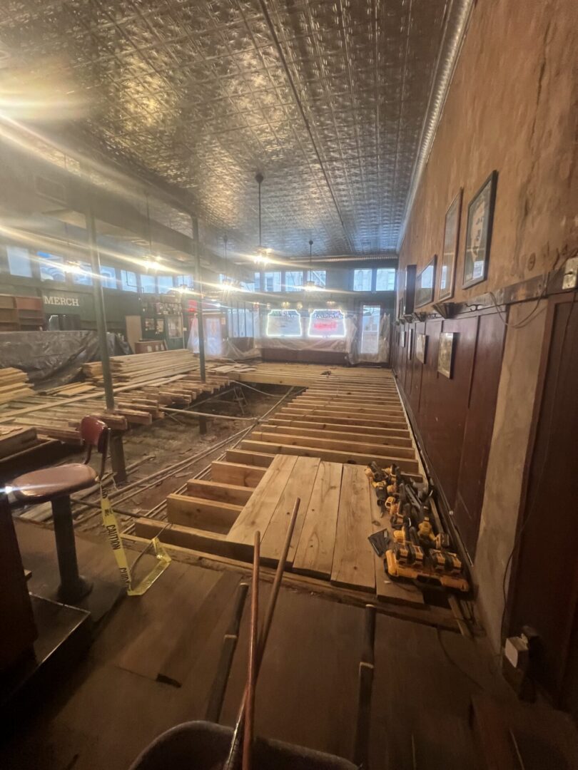 Bar interior under renovation with exposed joists