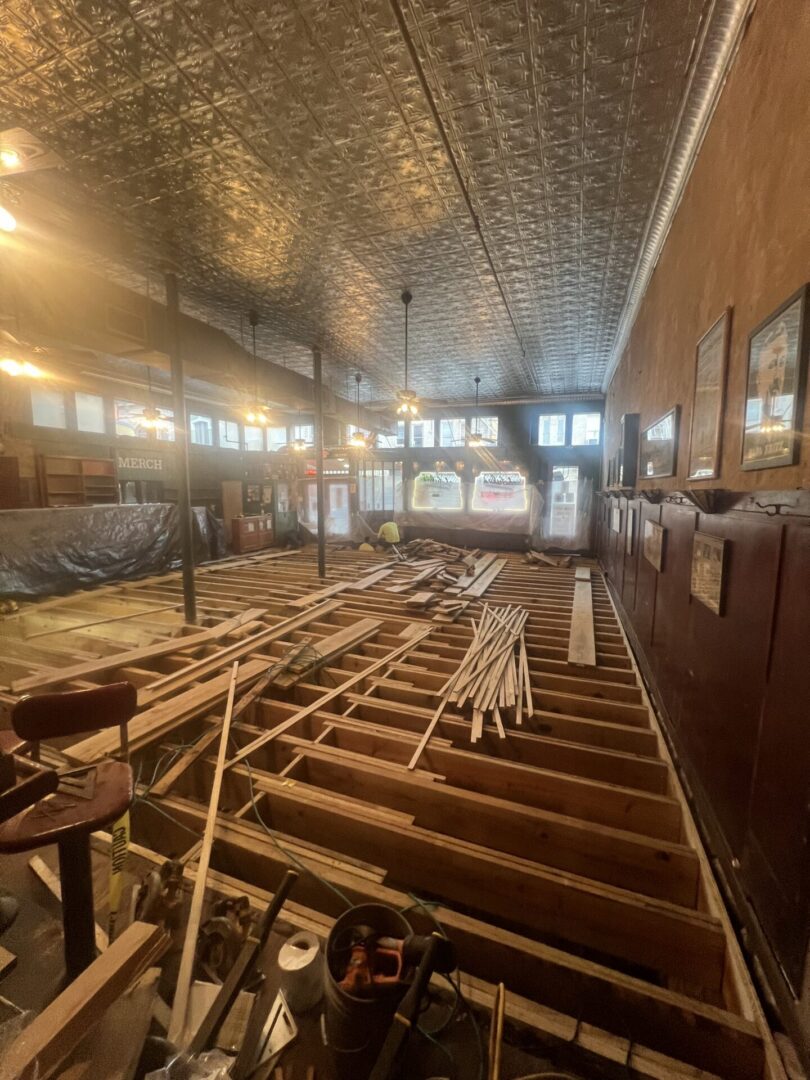 Historic interior under renovation with exposed floor joists