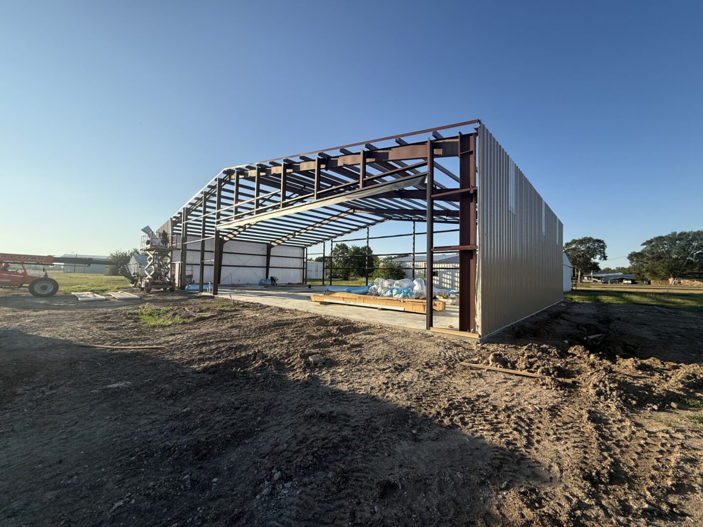 Steel-framed metal building under construction