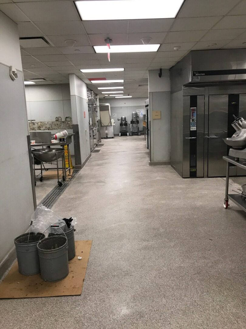 Empty industrial bakery kitchen with mixers